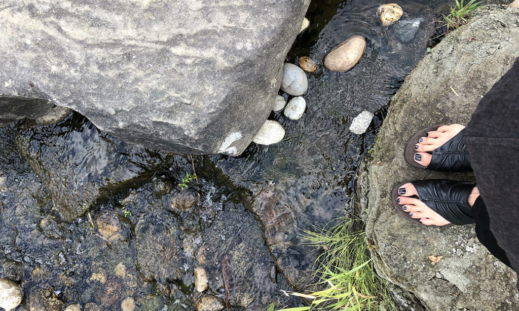 feet by a stream photo by cristina viviani